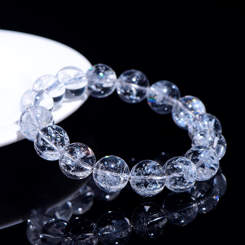 WhisperCrystal™ Natural Himalayan Rainbow Clear Quartz Bracelet featuring hand-polished transparent round beads with natural rainbow inclusions, available in classic clear and rainbow styles for everyday crystal jewelry.