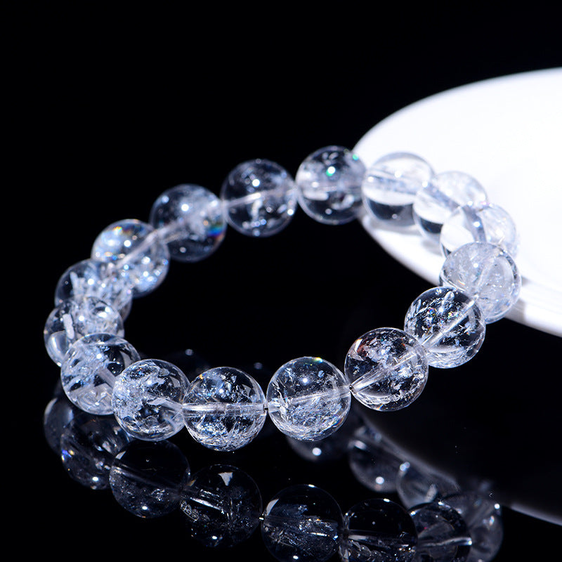 WhisperCrystal™ Natural Himalayan Rainbow Clear Quartz Bracelet featuring hand-polished transparent round beads with natural rainbow inclusions, available in classic clear and rainbow styles for everyday crystal jewelry.