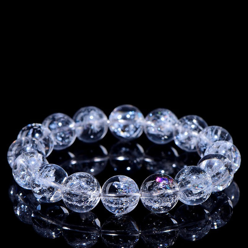 WhisperCrystal™ Natural Himalayan Rainbow Clear Quartz Bracelet featuring hand-polished transparent round beads with natural rainbow inclusions, available in classic clear and rainbow styles for everyday crystal jewelry.