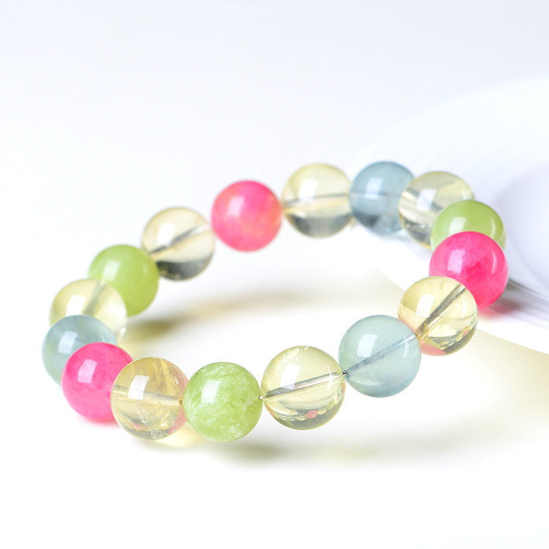 WhisperCrystal™ Natural Multi-Gemstone Crystal Bracelet featuring smooth hand-polished round beads in soft green, blush pink, sky blue, and golden tones, designed as an elegant crystal bracelet for women.